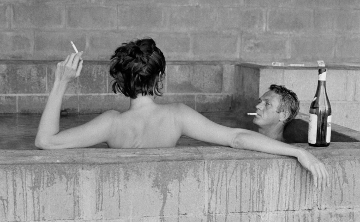 Steve McQueen and Neile Adams taking a sulfur bath